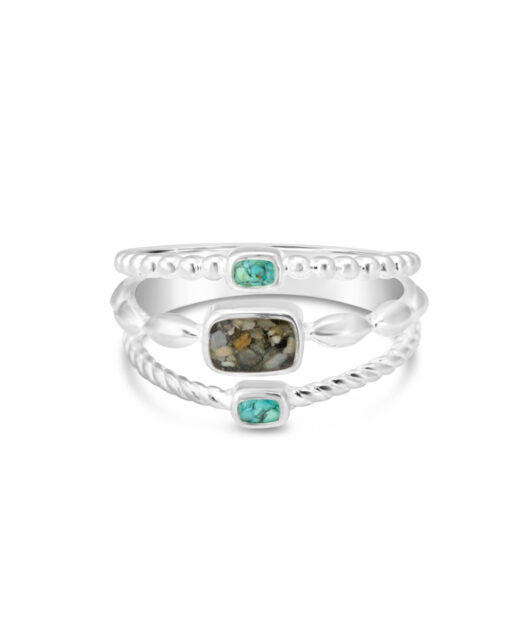 Sterling silver stacked ring with three bands, each containing a unique sand or earth element.