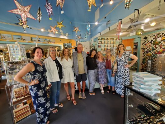 Group photo of Holly, Dan, Kate, and others at a past trunk show of Dune Jewelry at Suncatchers' Dream on Sanibel Island.