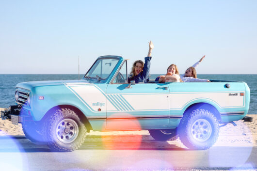 Holly, Dune Jewelry's founder and CEO, and her two daughters in a light blue truck driving in Cape Cod. Mother's Day Jewelry Gift Guide header image.