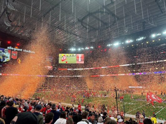Super Bowl orange confetti in air.