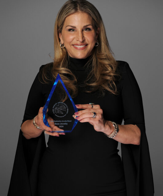 Holly, Founder of Dune Jewelry, accepts the award for Best Destination Jewelry Brand.