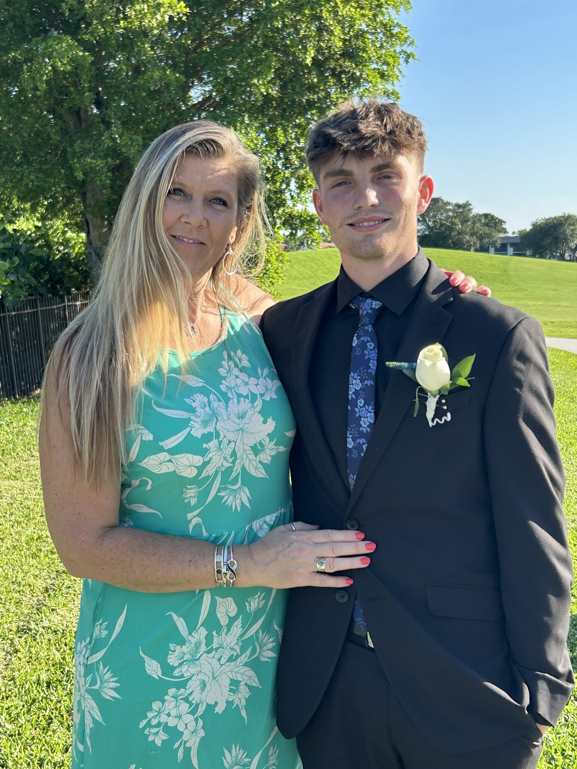 Kate, Dune Jewelry's director of sales, and her son pose for a picture.