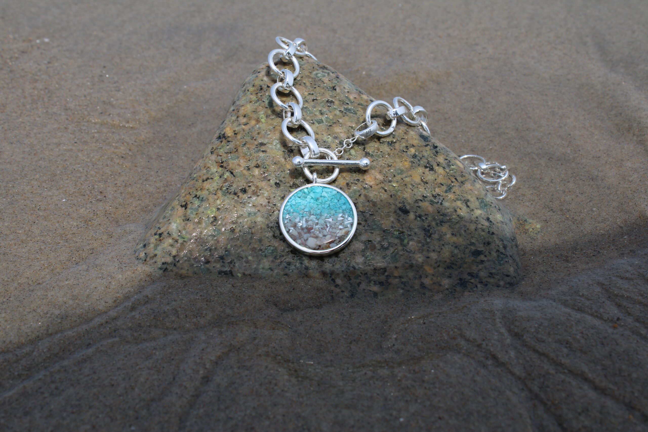 Dune Jewelry's Mediterranean necklace ocean gradient on the beach, great Mother's Day gift.