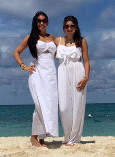 Ally poses with her daughter on the beach.