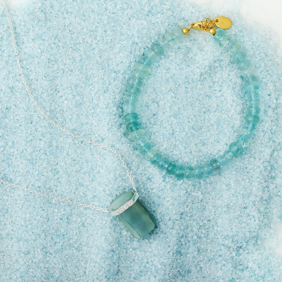 Camille Collection x Dune Jewelry product shot featuring the Raw Aquamarine Beaded Bracelet and the Blue Ice Aquamarine Necklace.