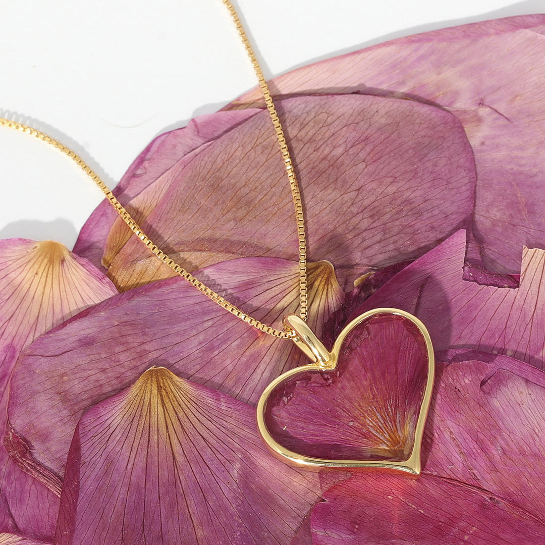Gold Heart of Sand Necklace featuring beach rose flower petals from the Dune Sandbank, floral jewelry is a summer fashion trend.