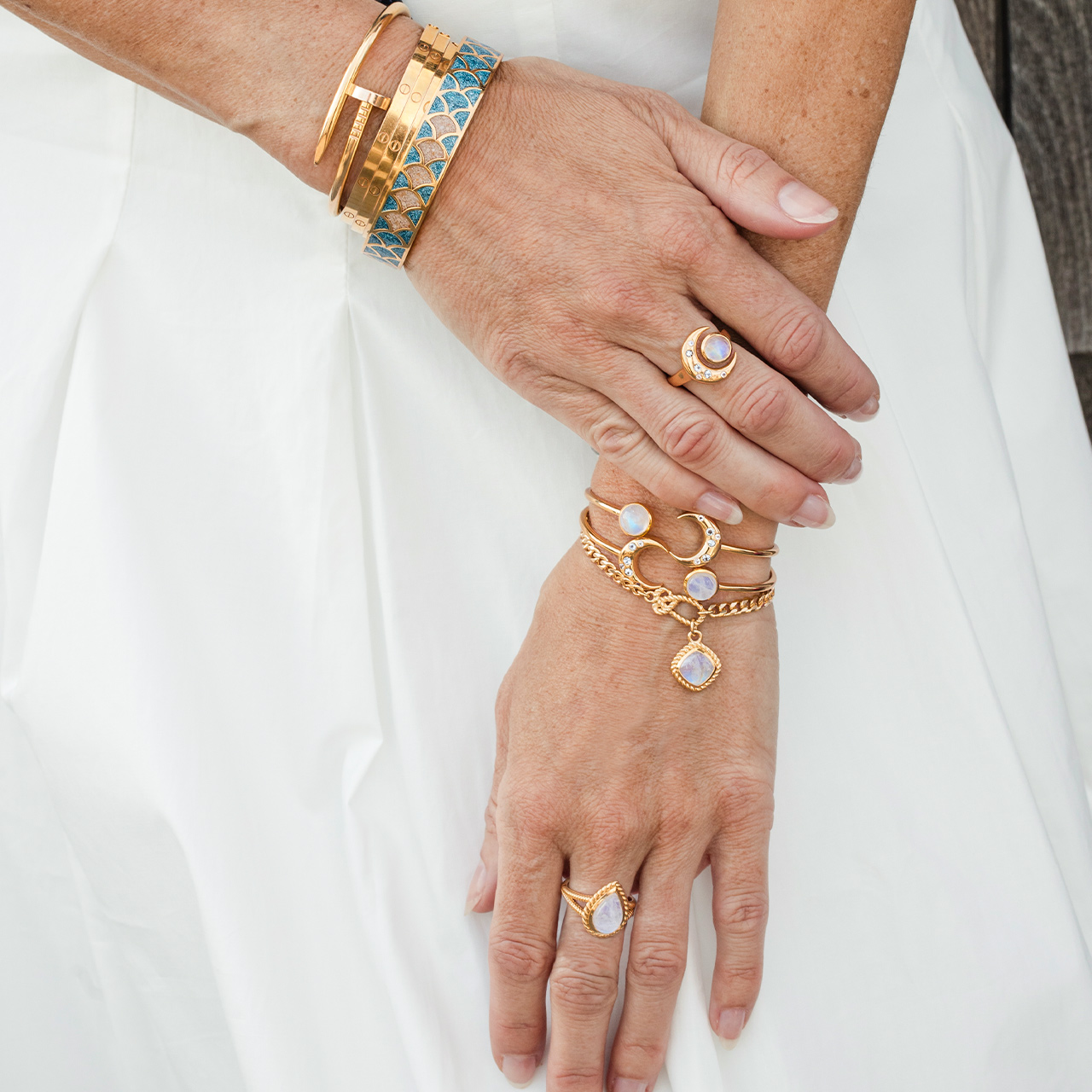 Captain Kate's 14k gold vermeil bracelet stack featuring moonstone and personalized celestial and nautical jewelry designs, great for the summer.