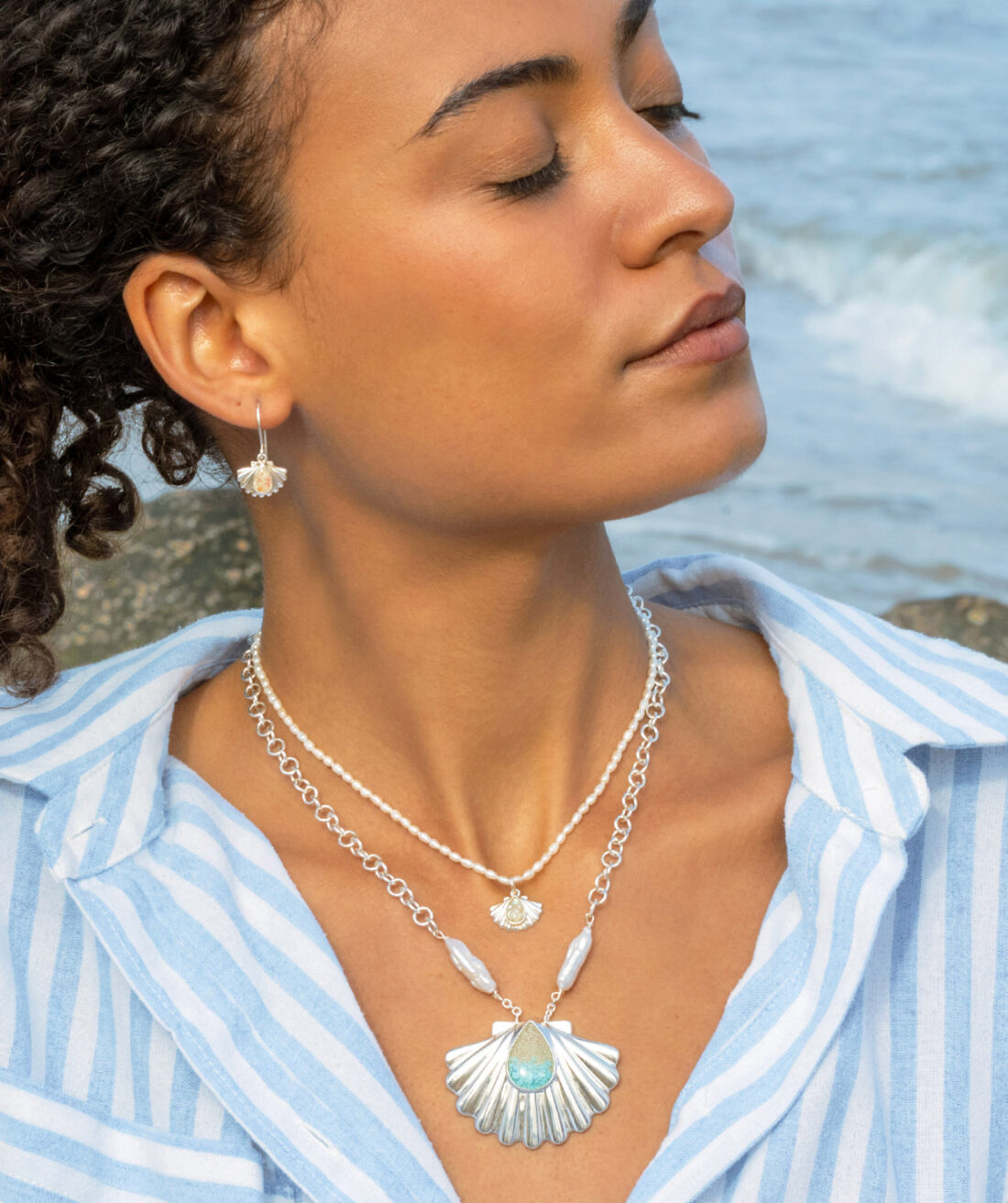 Summer trend alert: summer jewelry trends include Coastal Shell Necklaces with baroque pearls, turquoise ocean gradients, sterling silver and your choice of sand or earth element.