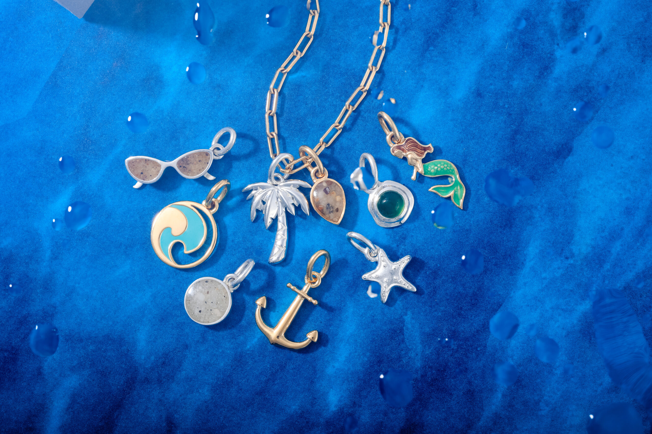 Beachy necklaces with silver and gold charms.