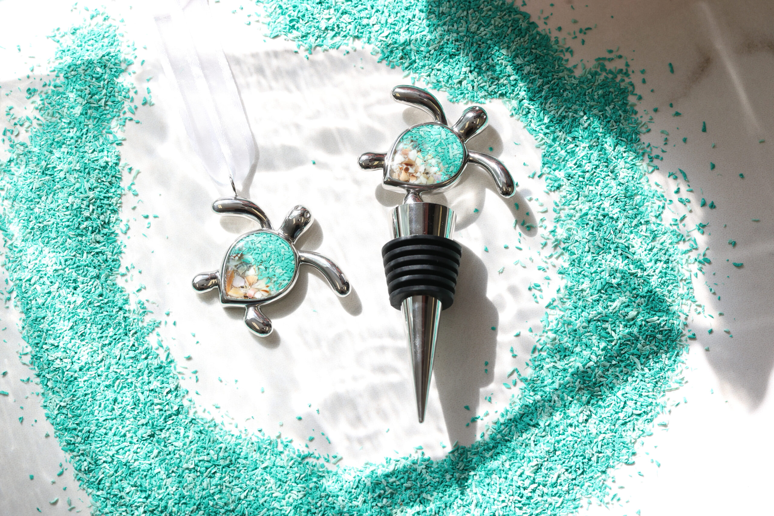 Sustainable ocean jewelry turtle ornament and turtle wine stopper and wine accessory.