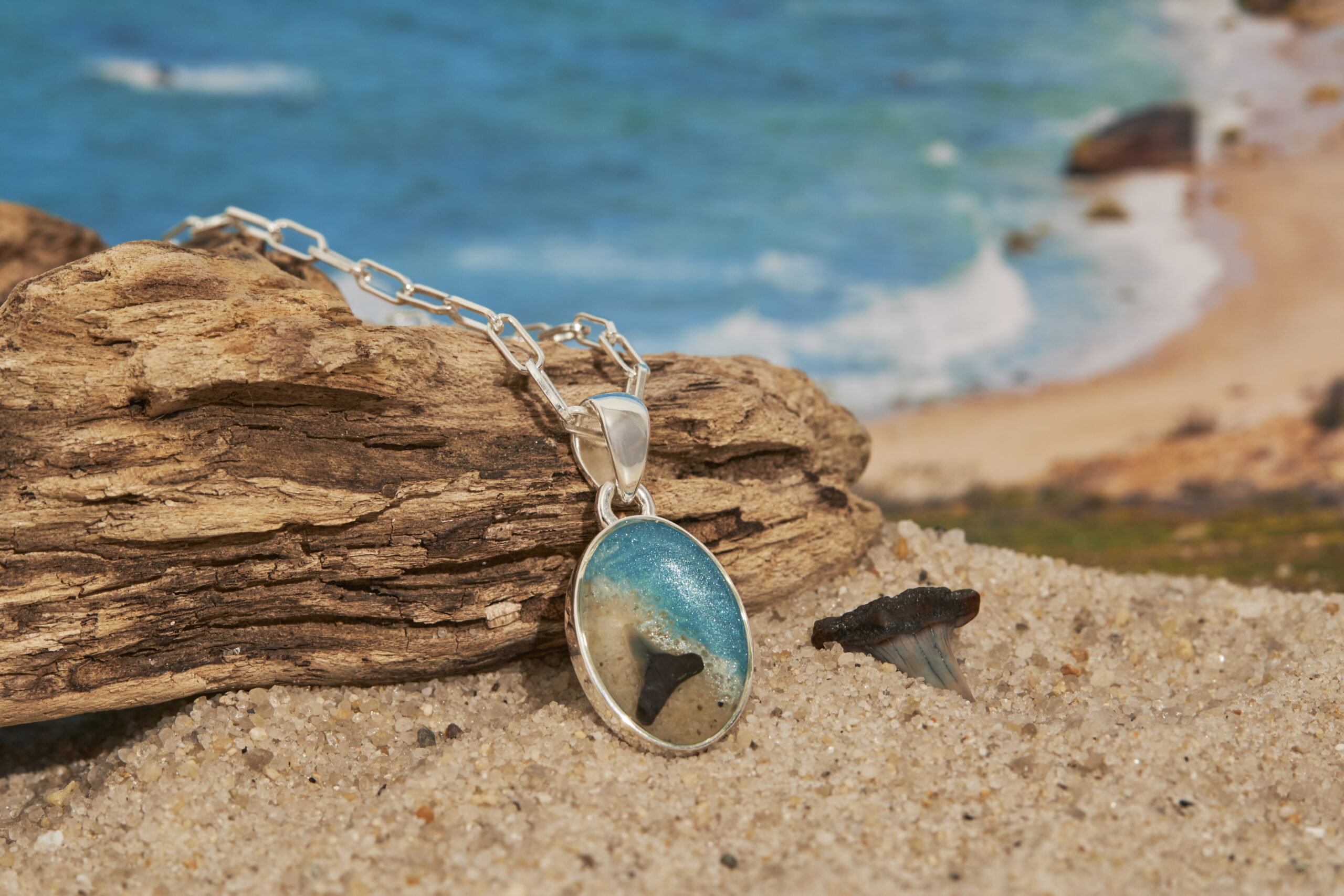 Shark week, shark tooth necklace, and ocean-conservation souvenirs. Ocean-inspired gifts with Martha's Vineyard Sand. Beach sand necklace.
