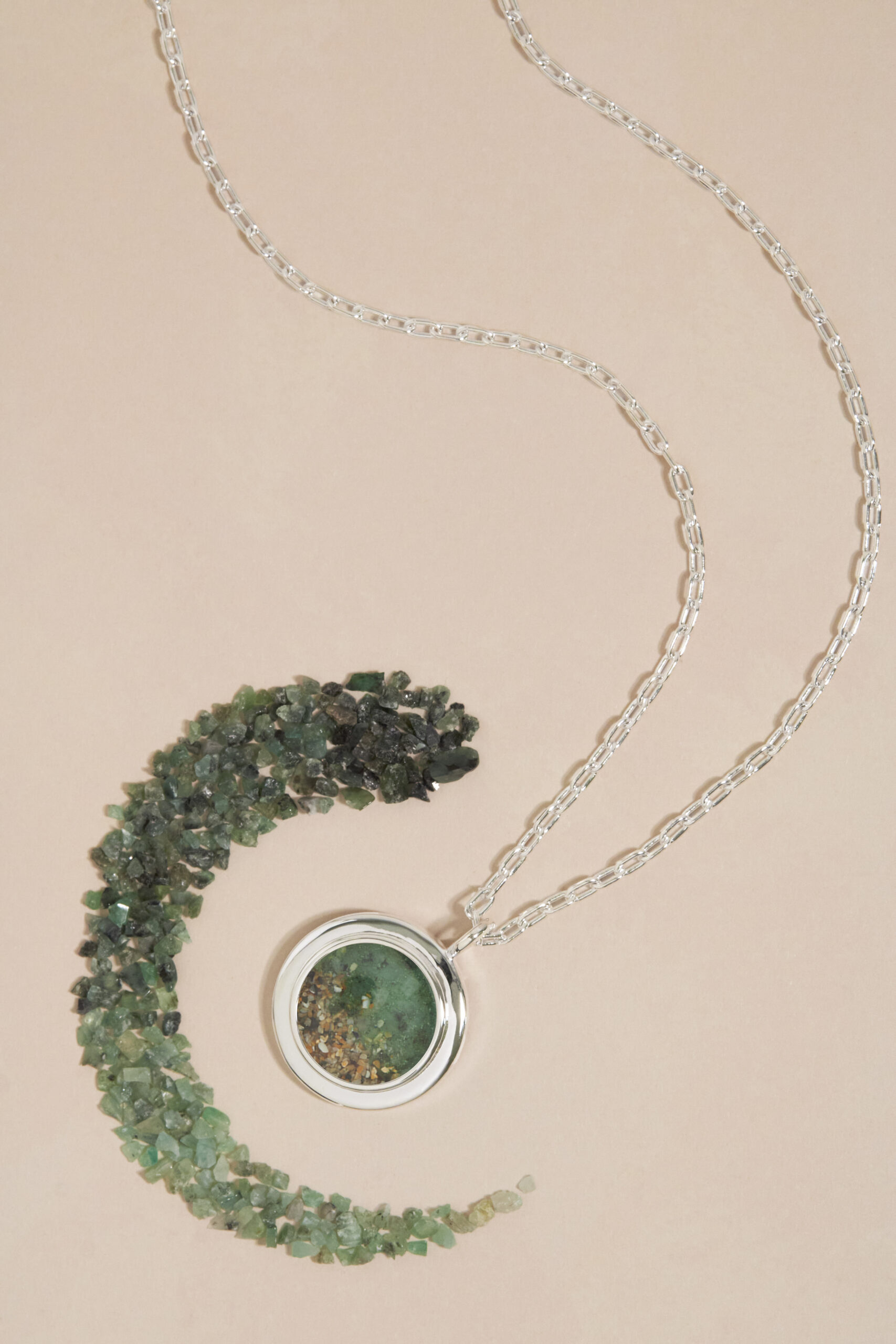 Natural precious gemstone gradients personalized with meaningful sand or earth. Custom Ruby, Emerald and Sapphire gemstone gradient jewelry by Dune Jewelry.