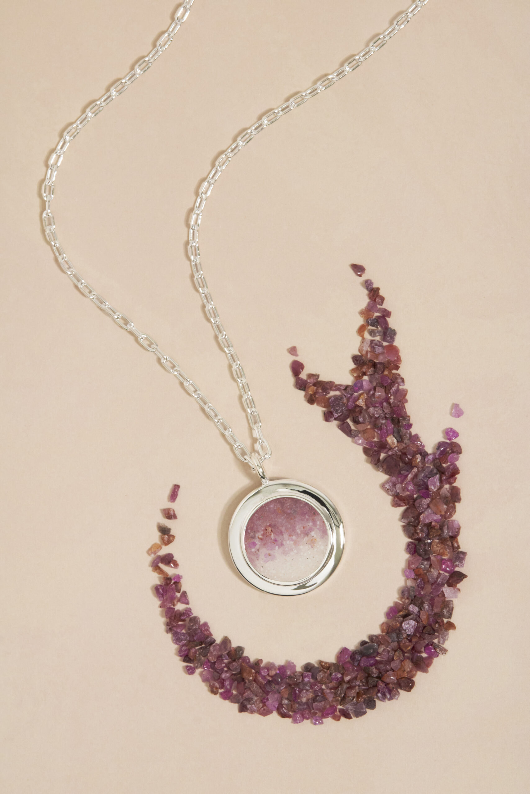 Natural precious gemstone gradients personalized with meaningful sand or earth. Custom Ruby, Emerald and Sapphire gemstone gradient jewelry by Dune Jewelry.