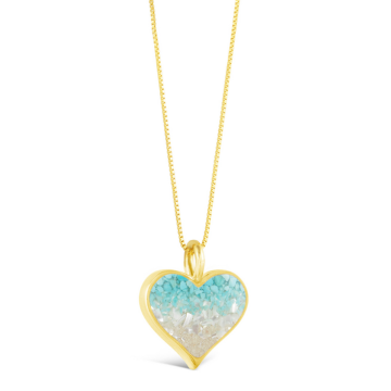 This heartwarming design features a 14k gold vermeil heart handcrafted with an ocean gradient and sand, shells, or earth elements from your favorite location.