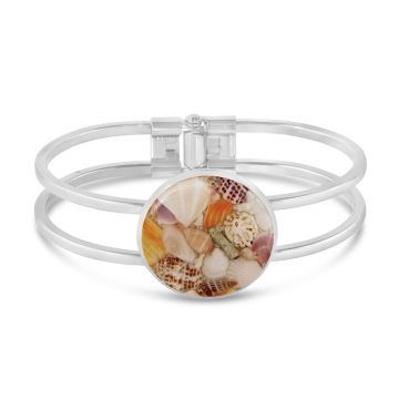 Sterling silver bold bracelet cuff by Dune Jewelry with crushed shells in a round centerpiece.