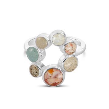 Sterling silver ring with seven customizable sand and earth element settings, inspired by travel memories made in every continent.