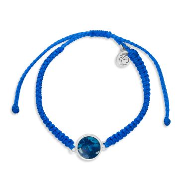 Blue bracelet made with hand-wrapped plastic cord and a circular pendant made with earth elements and stainless steel.