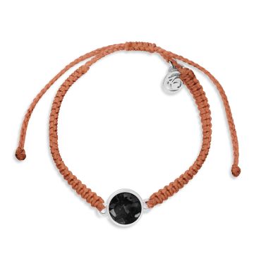 Copper bracelet made with hand-wrapped plastic cord and a circular pendant made with earth elements and stainless steel.