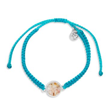 Teal bracelet made with hand-wrapped plastic cord and a circular pendant made with earth elements and stainless steel.