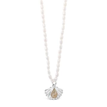 Natural pearl chain necklace with a statement piece shell pendant and teardrop-shaped sand setting.