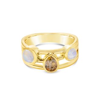 Ocean trio stacker ring by Captain Kate, featuring two flanking moonstone cabochons and a sand or earth element as center stage.