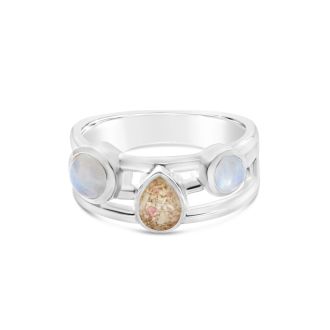 Ocean trio stacker ring by Captain Kate, featuring two flanking moonstone cabochons and a sand or earth element as center stage.