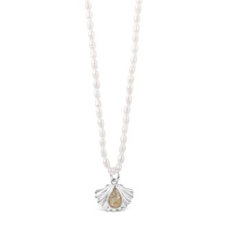 Natural pearl chain necklace with a statement piece shell pendant and teardrop-shaped sand setting.