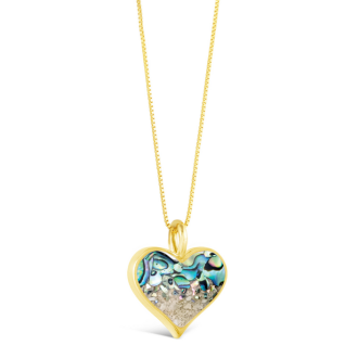 This heartwarming design features a 14k gold coastal jewelry vermeil heart handcrafted with an abalone shell fragment gradient and sand, shells, or earth elements from your favorite location. 