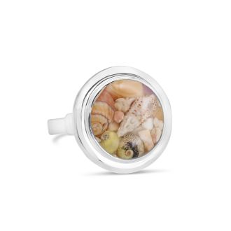 Nautical cocktail ring by Dune Jewelry in sterling silver with natural crushed shell fragments. Features a round setting.
