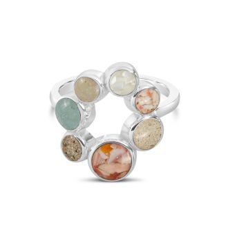 Sterling silver ring with seven customizable sand and earth element settings, inspired by travel memories made in every continent.