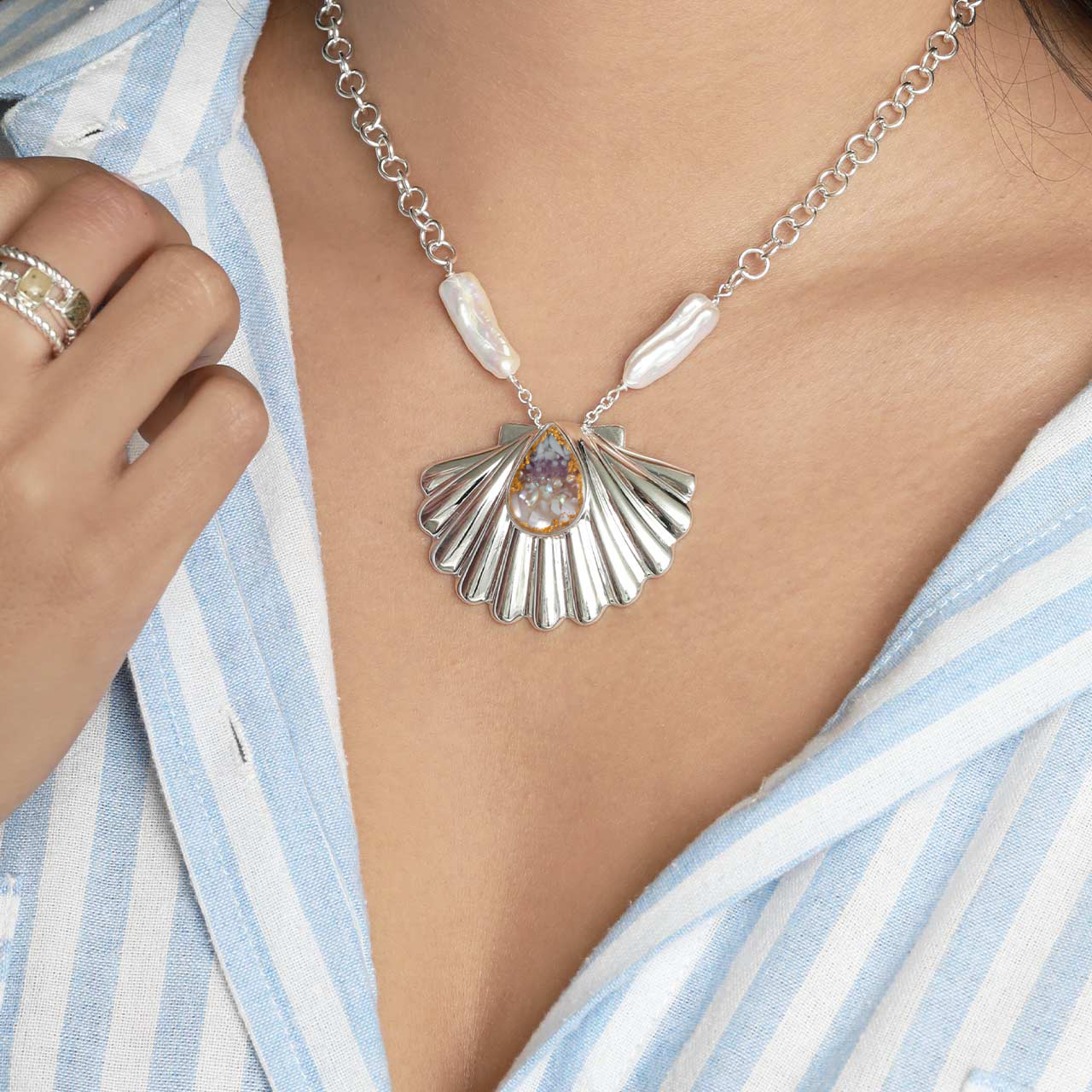 Aphrodite-inspired coastal shell necklace in sterling silver with pearls, gemstones, shells & gold, luxury jewelry from the Female Icon Collection.