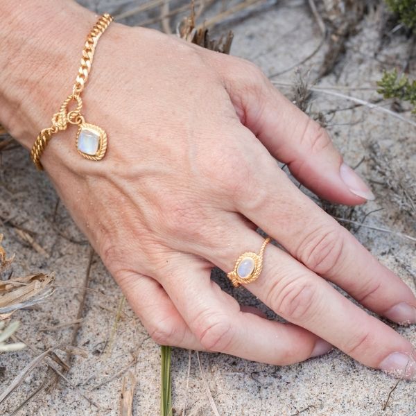 Sterling silver and gold vermeil Mariner’s Moonstone design featuring a radiant rainbow moonstone ring in a nautical knot design, the perfect nautical jewelry for her, for ocean-inspired elegance.