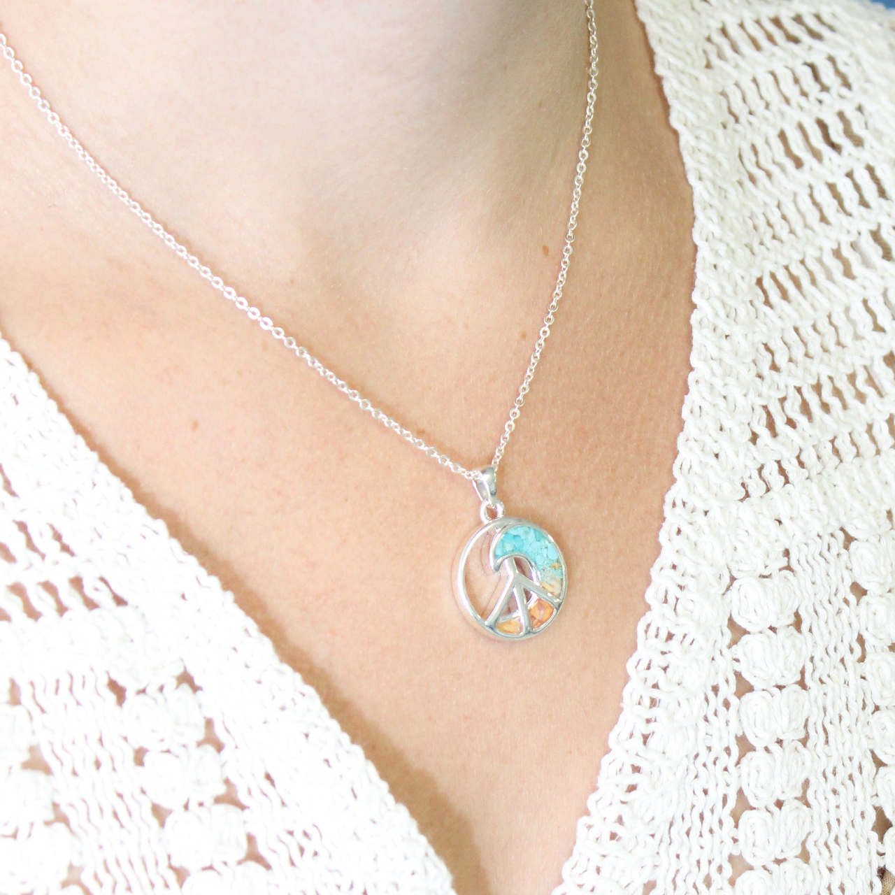 Wave and peace symbol necklace handcrafted with sterling silver and your choice of sand, shells, stones, or earth elements.