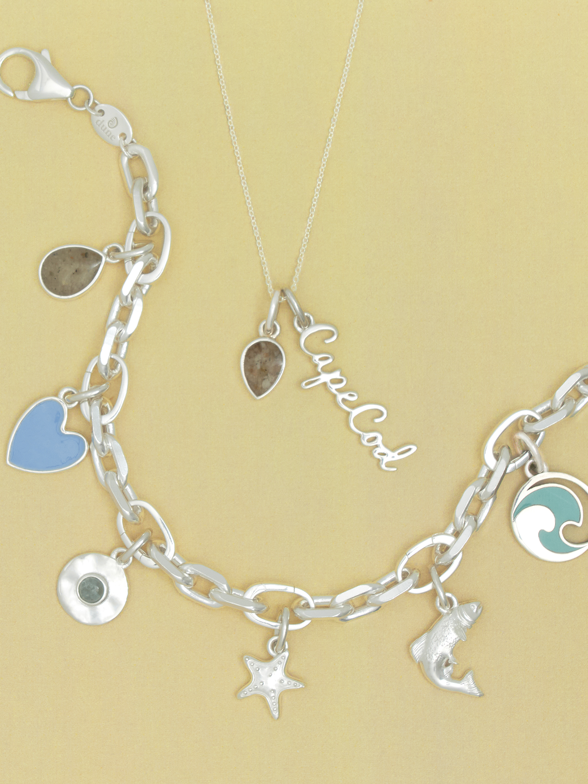Custom jewelry personalized with sand from Dune Jewelry's Sandbank of more than 5,500 locations during the Bon Voyage Event. Affordable jewelry.