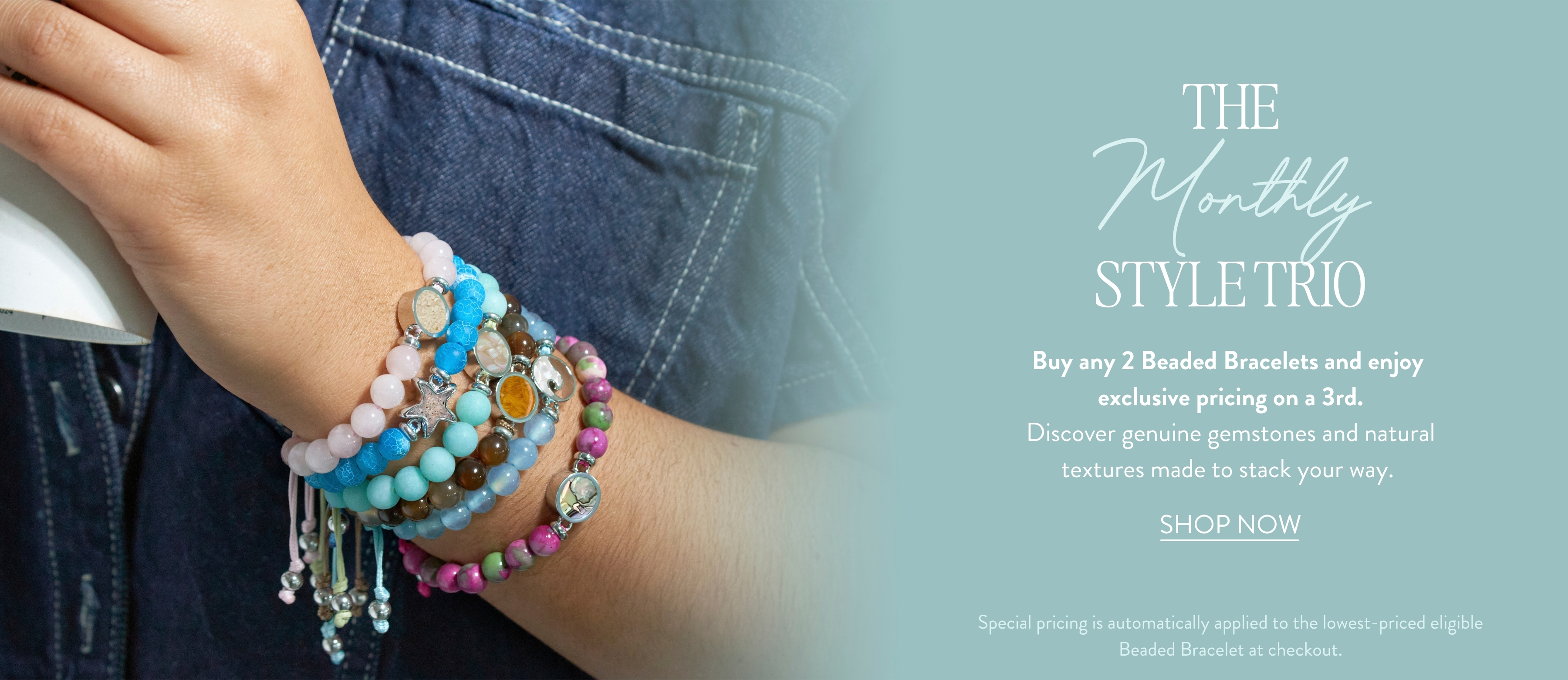 Woman wearing customizable silver stacker rings with colorful sand, birthstone and earth elements. Monthly jewelry deals and discounts.